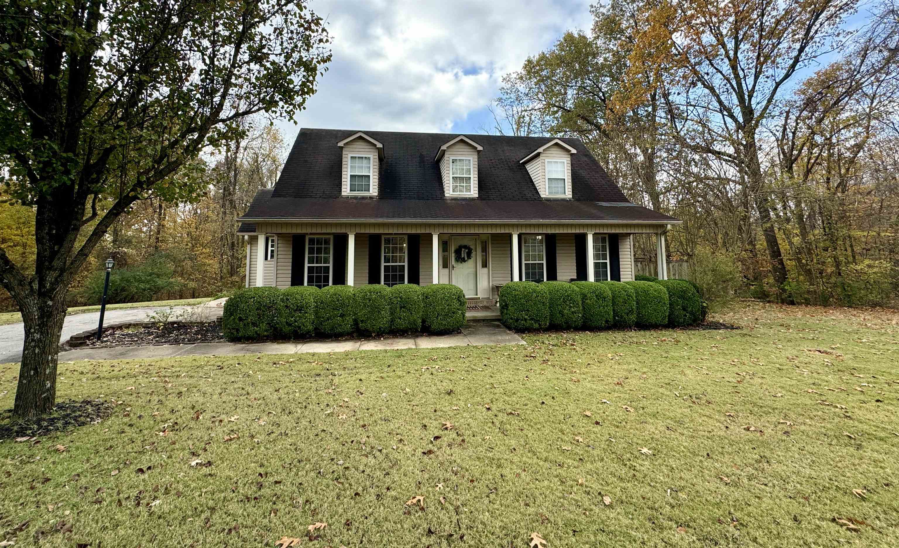 47 Chisholm Lake Road Ripley, TN 38063 - Photo 24 of 26 a front view of a house with a garden