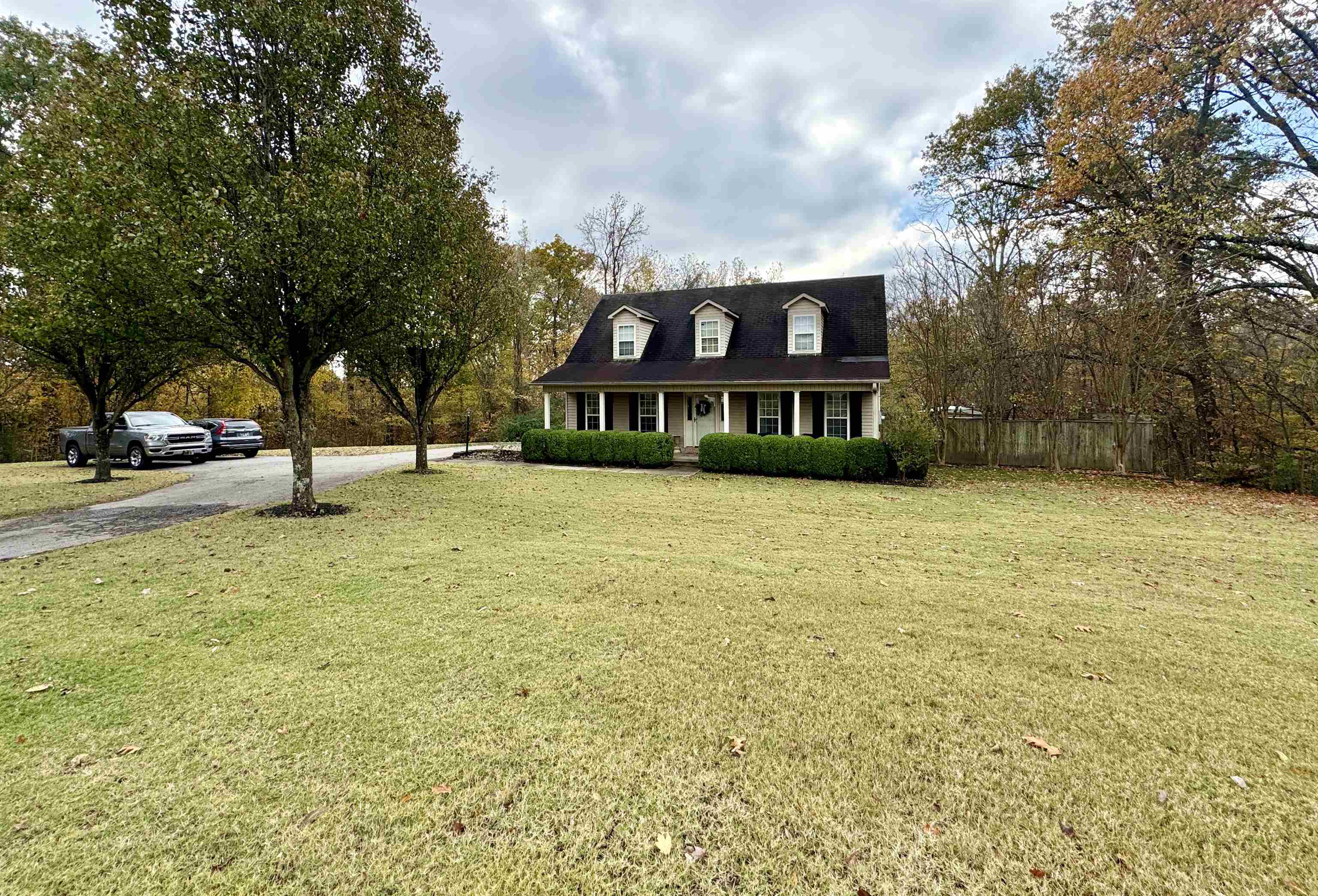 47 Chisholm Lake Road Ripley, TN 38063 - Photo 4 of 26 a view of a swimming pool and a yard in front of the house