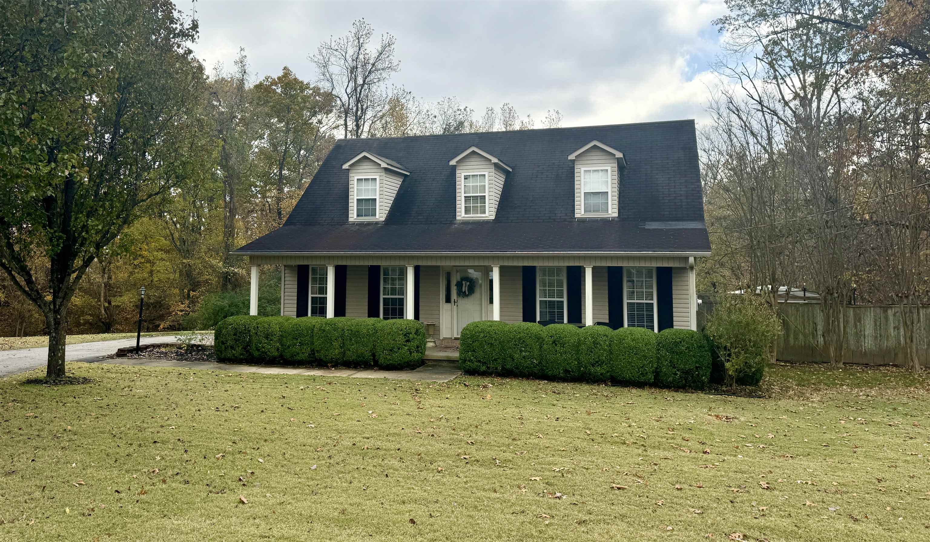 47 Chisholm Lake Road Ripley, TN 38063 - Photo 5 of 26 a front view of a house with garden