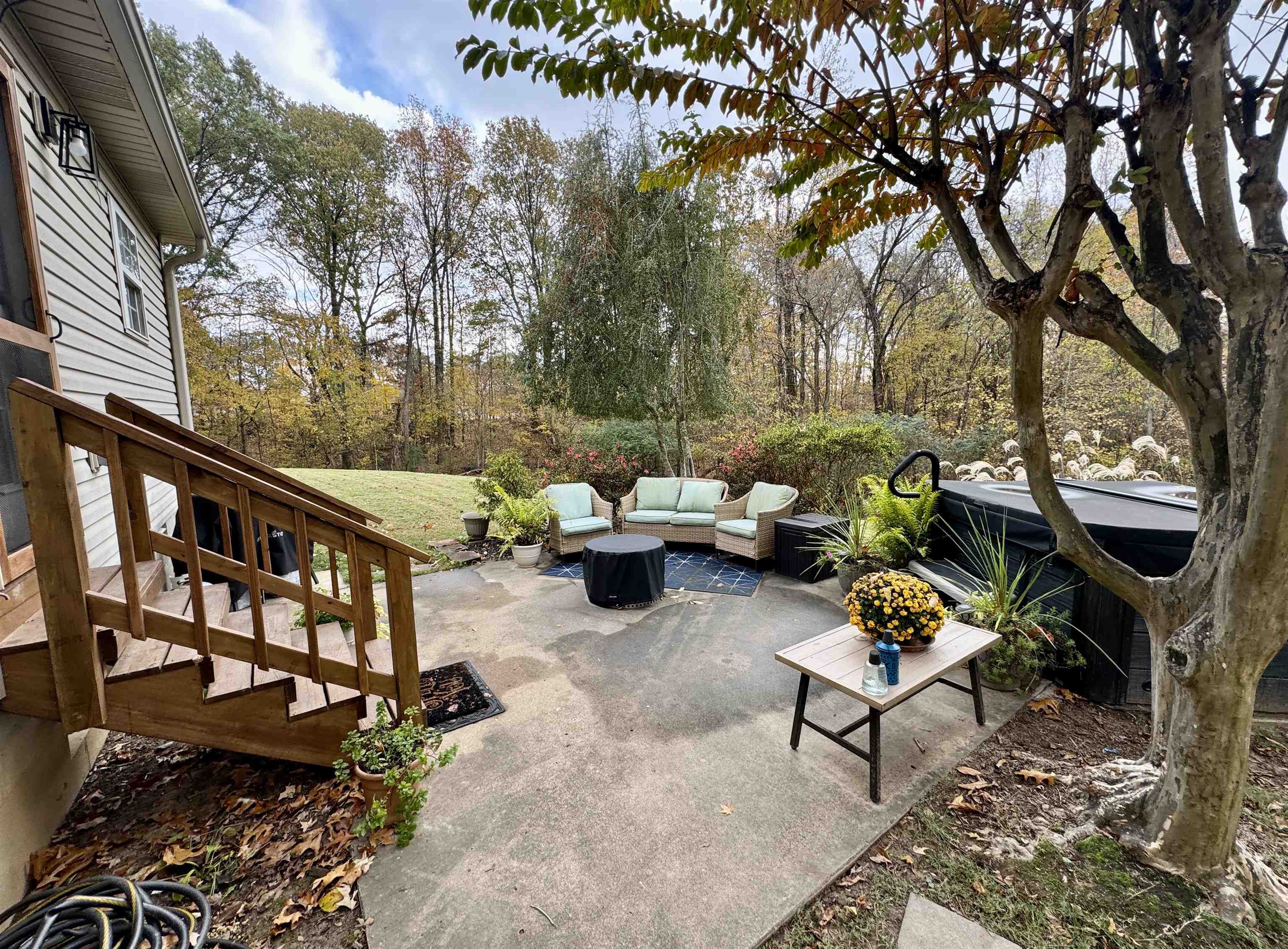 47 Chisholm Lake Road Ripley, TN 38063 - Photo 6 of 26 a backyard of a house with table and chairs