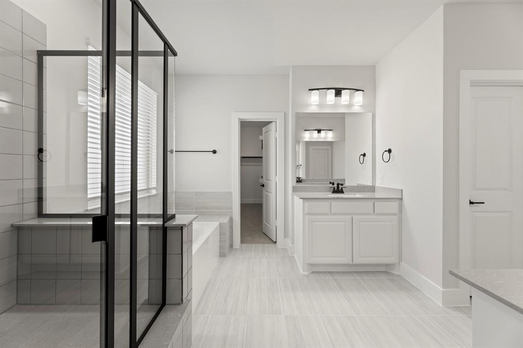 4213 Bellview Way Celina, TX 75009 - Photo 17 of 29 a bathroom with a granite countertop sink a toilet and shower