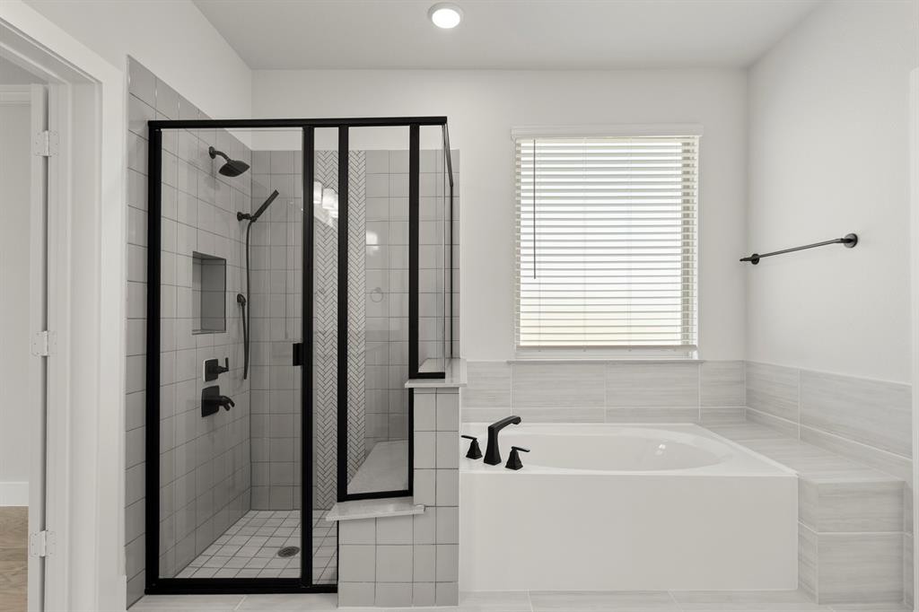 4213 Bellview Way Celina, TX 75009 - Photo 18 of 29 a bathroom with a bathtub and a shower