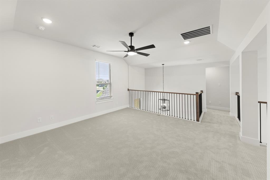4213 Bellview Way Celina, TX 75009 - Photo 22 of 29 a view of a hallway with a ceiling fan