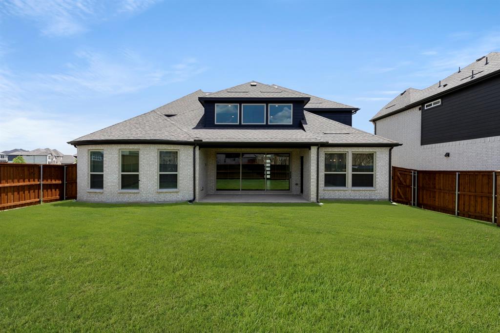 4213 Bellview Way Celina, TX 75009 - Photo 26 of 29 a front view of a house with a garden