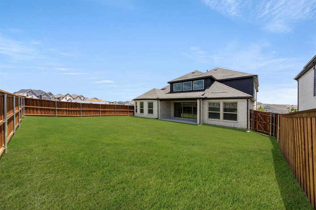 4213 Bellview Way Celina, TX 75009 - Photo 27 of 29 a front view of a house with garden