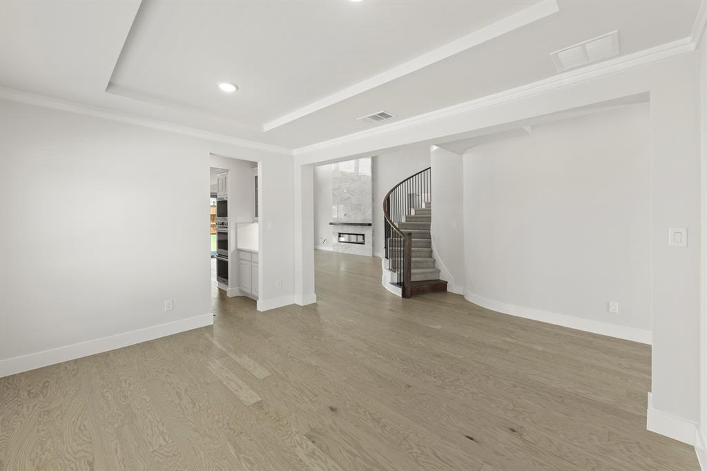 4213 Bellview Way Celina, TX 75009 - Photo 6 of 29 a view of an empty room with a fireplace