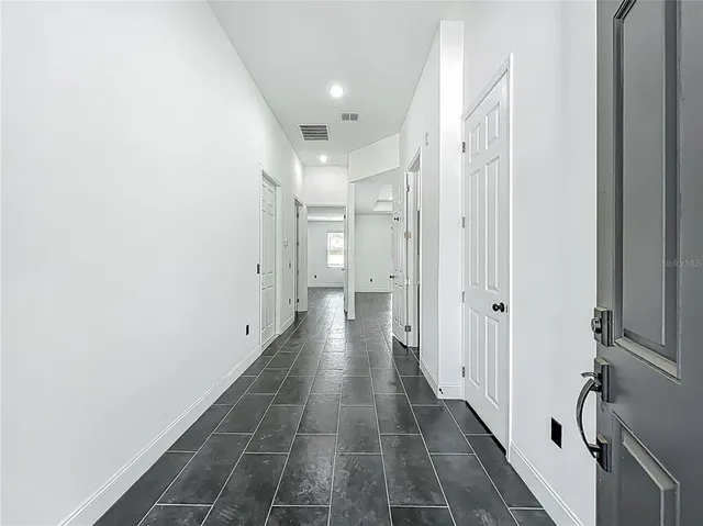 a view of a hallway with a granite top