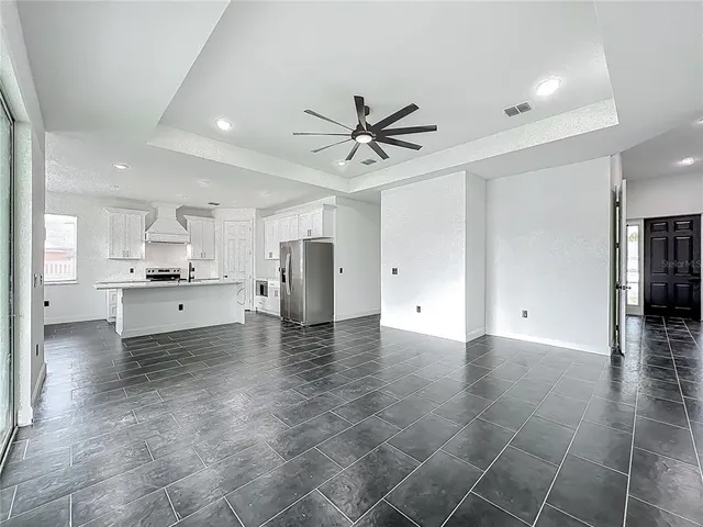 a view of a kitchen with a sink and a stove