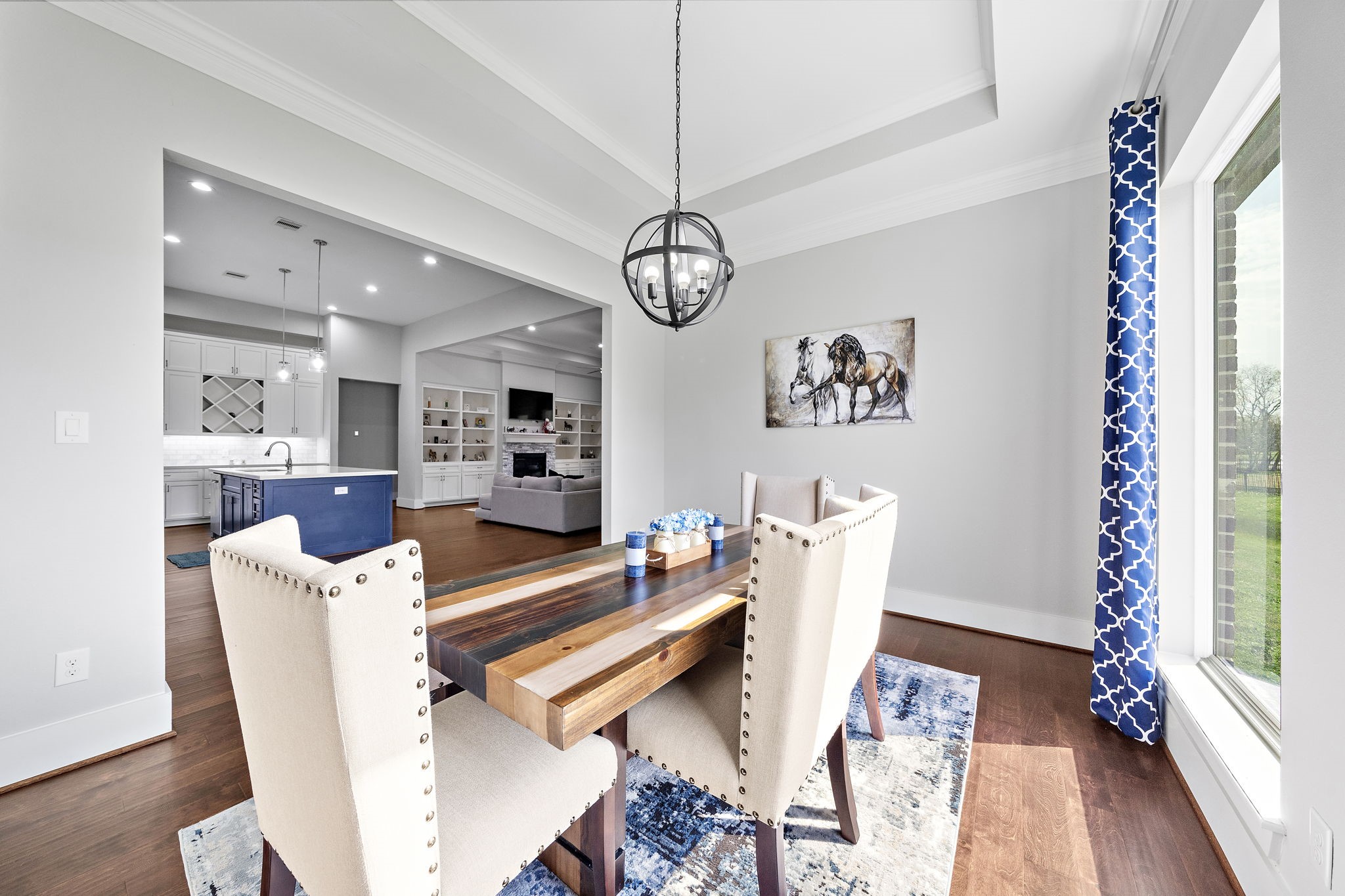 127 Cavalry Trail Drive Rosharon, TX 77583 - Photo 13 of 37 a dining room with furniture a rug and a chandelier