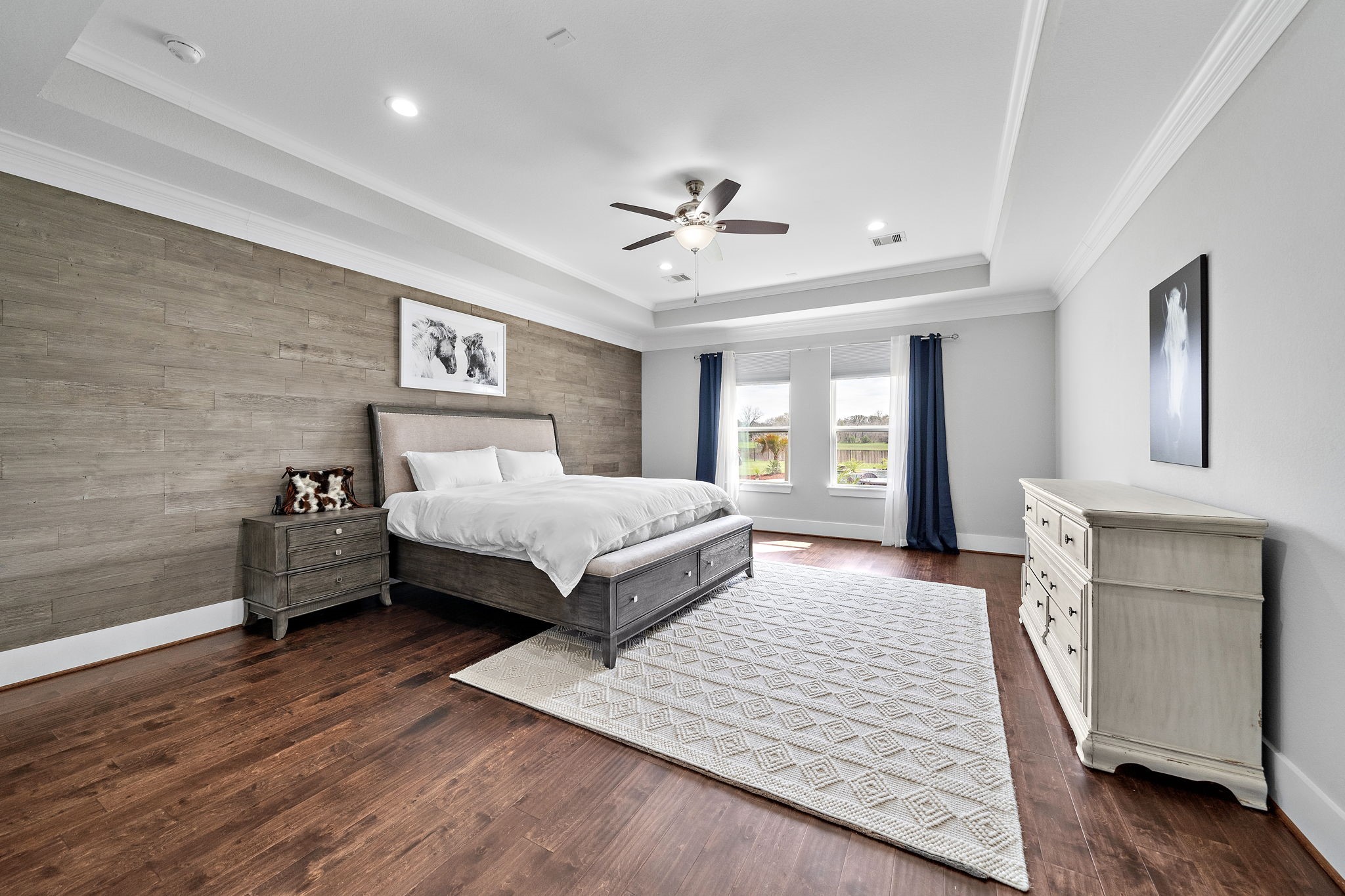 127 Cavalry Trail Drive Rosharon, TX 77583 - Photo 15 of 37 a bedroom with a large bed chandelier and a window