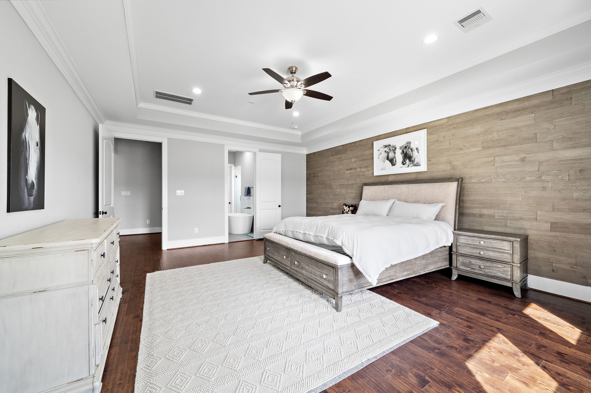 127 Cavalry Trail Drive Rosharon, TX 77583 - Photo 16 of 37 a bedroom with a bed and a chandelier