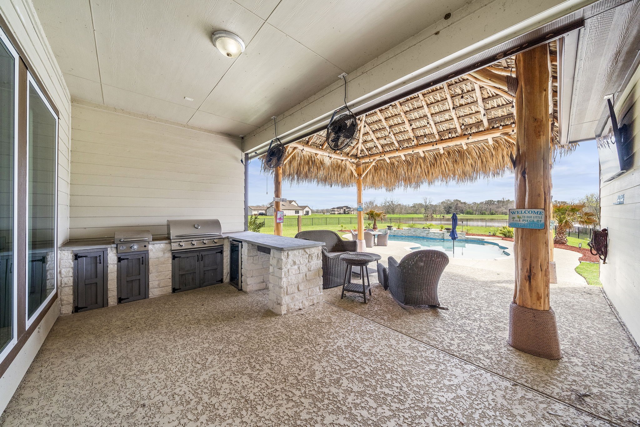 127 Cavalry Trail Drive Rosharon, TX 77583 - Photo 31 of 37 a view of a patio with a dining table and chairs