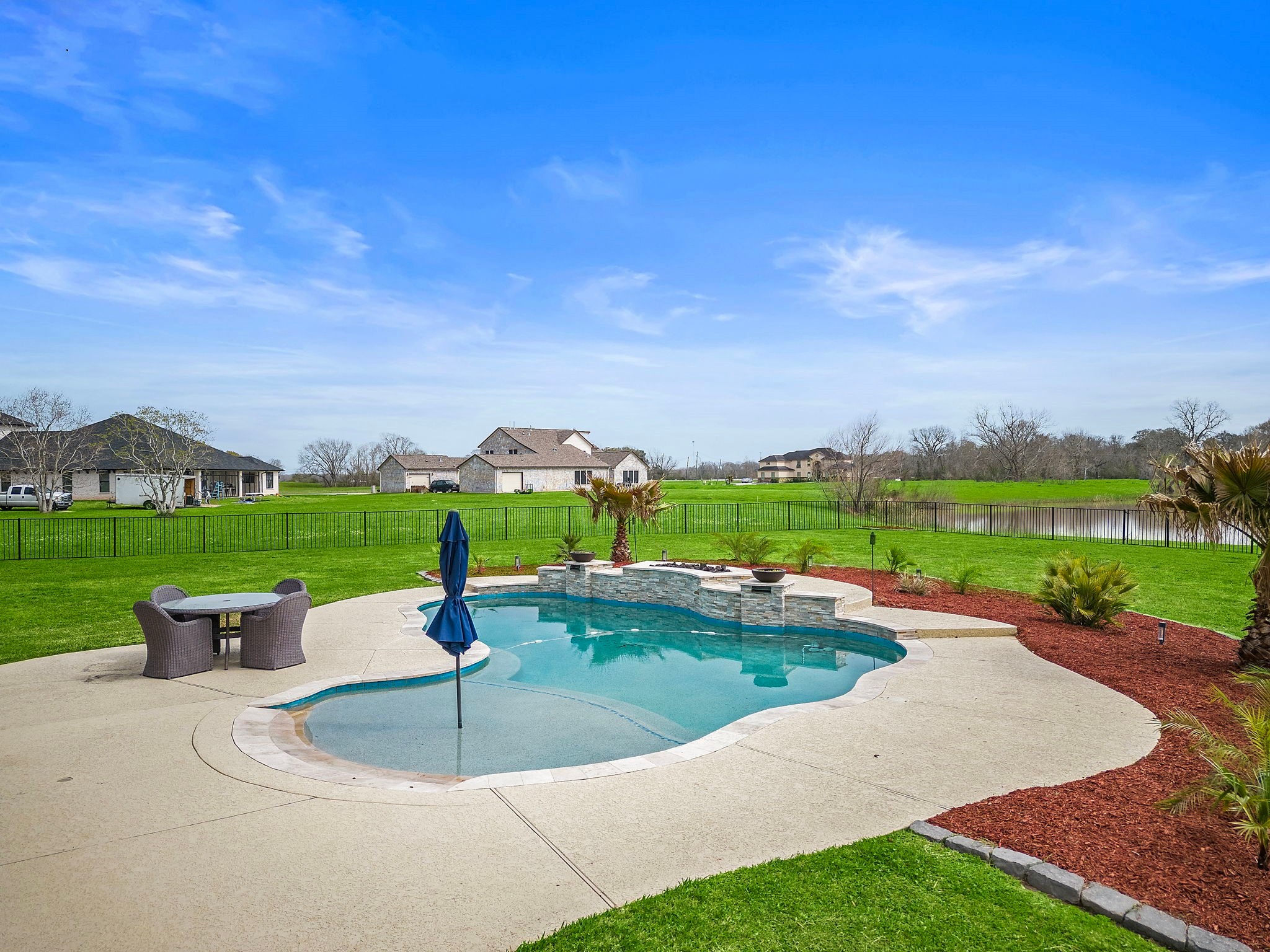 127 Cavalry Trail Drive Rosharon, TX 77583 - Photo 37 of 37 a view of a garden with lawn chairs