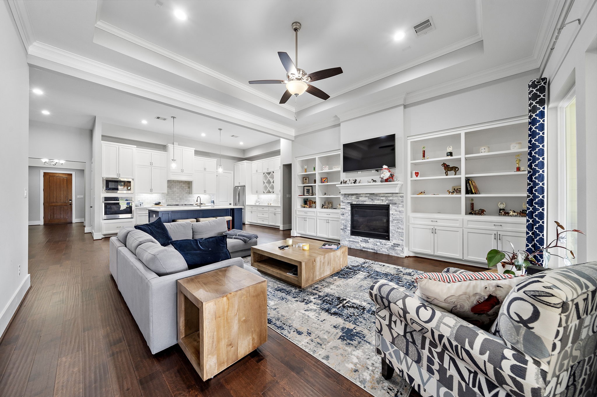 127 Cavalry Trail Drive Rosharon, TX 77583 - Photo 5 of 37 a living room with furniture flat screen tv and a fireplace