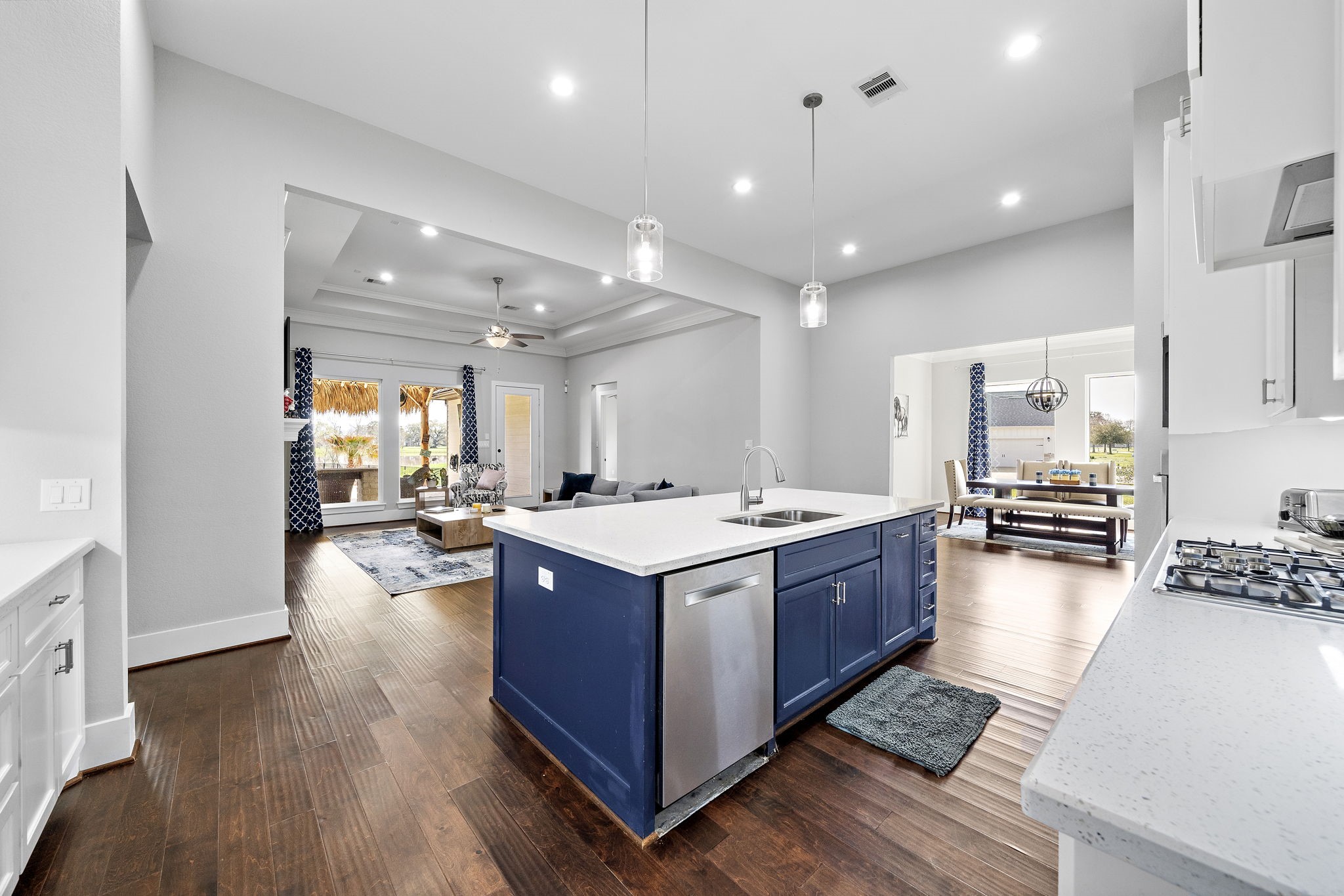 127 Cavalry Trail Drive Rosharon, TX 77583 - Photo 10 of 37 a large kitchen with stainless steel appliances granite countertop a large stove a refrigerator and a fireplace with wooden floor
