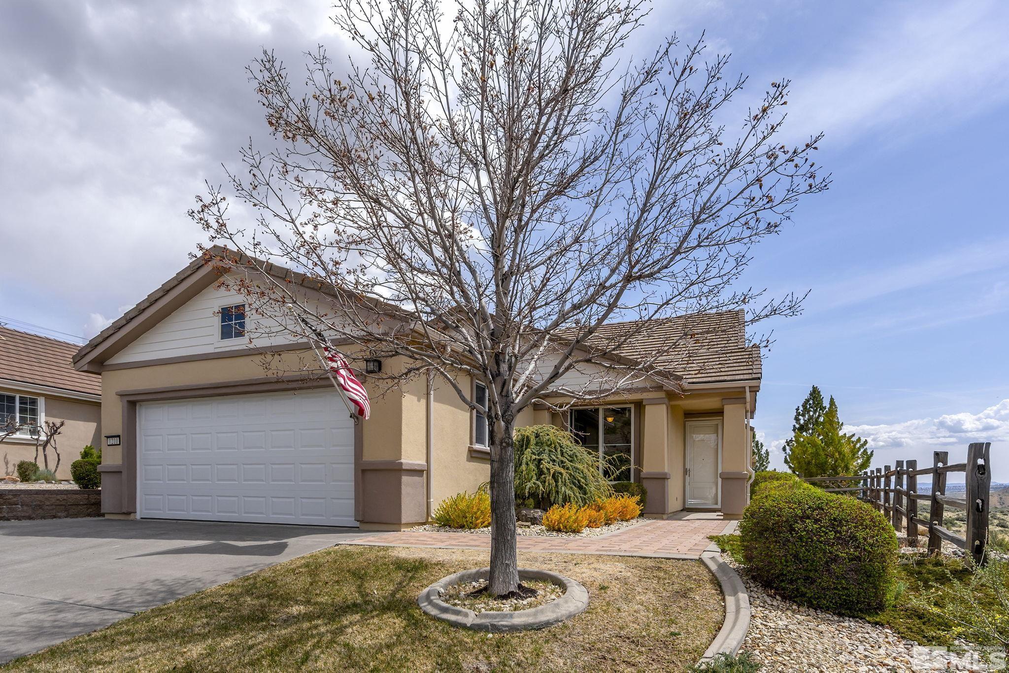 1210 Firefly Court Reno, NV 89523 - Photo 1 of 40 a front view of a house with garden