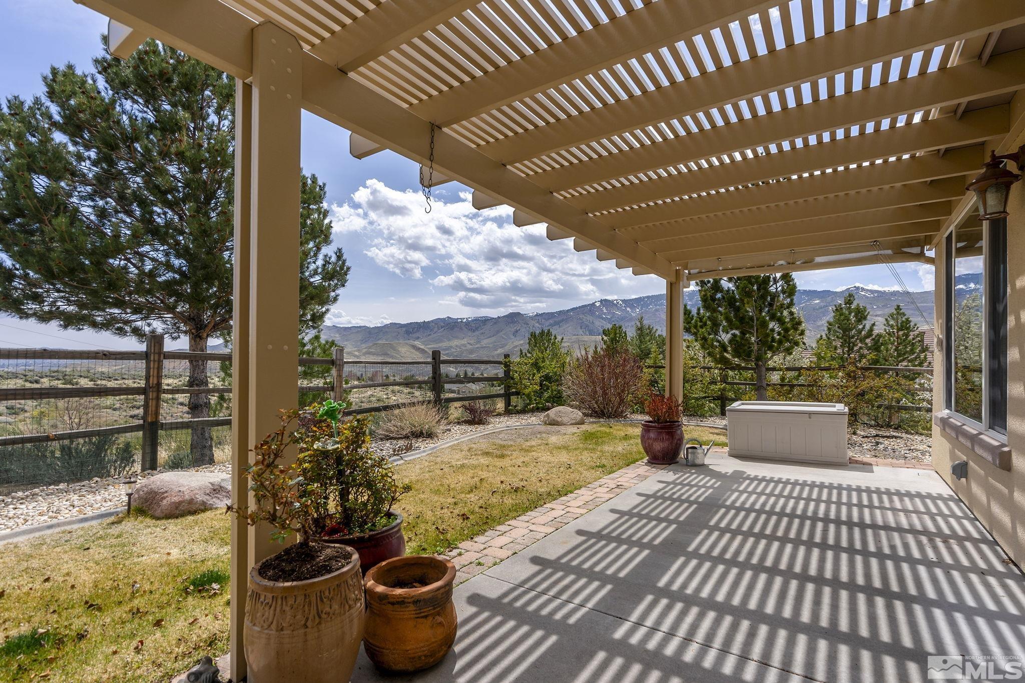 1210 Firefly Court Reno, NV 89523 - Photo 24 of 40 a view of a patio with couches table and chairs and potted plants
