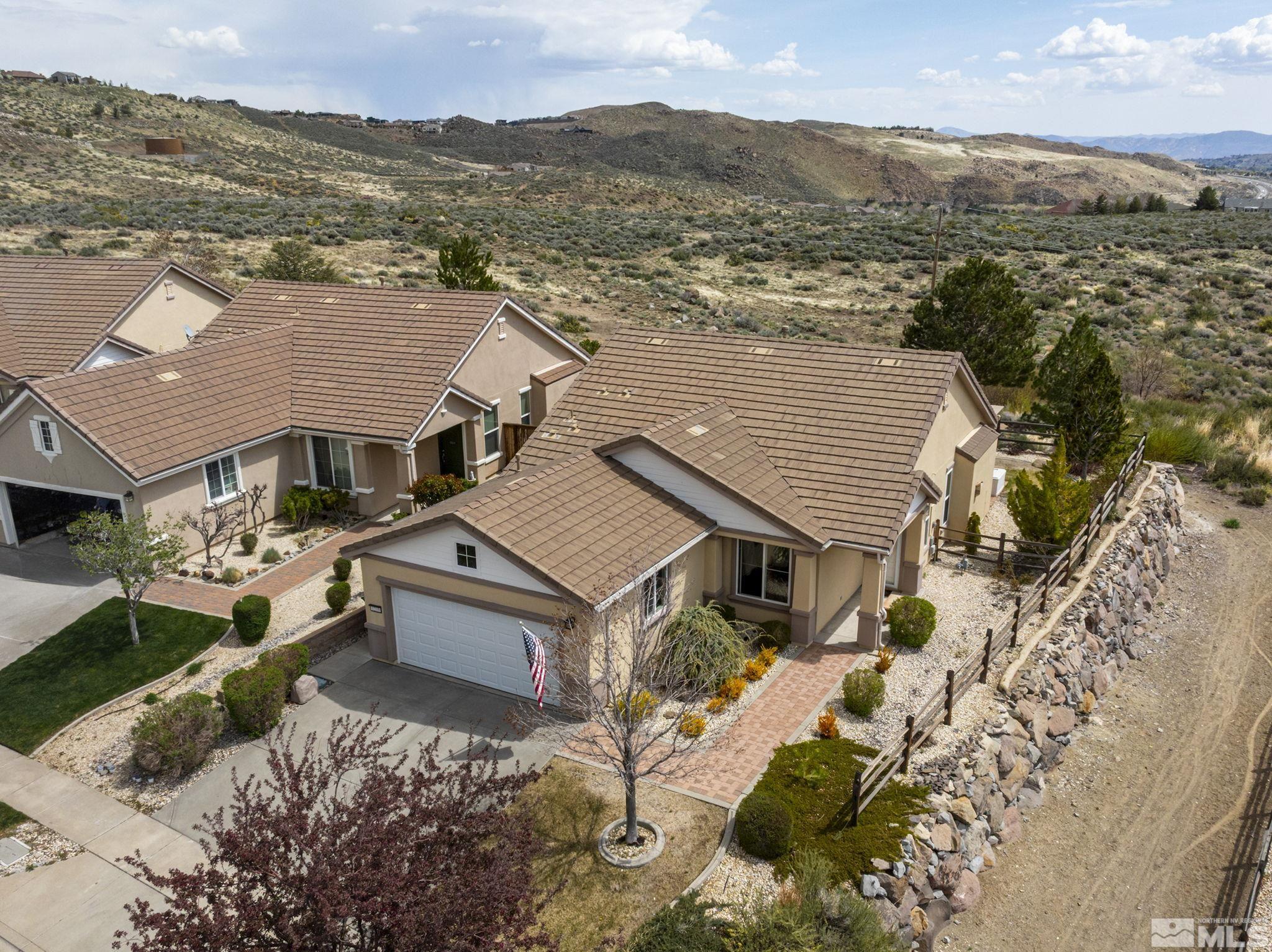 1210 Firefly Court Reno, NV 89523 - Photo 4 of 40 an aerial view of residential houses with outdoor space and trees