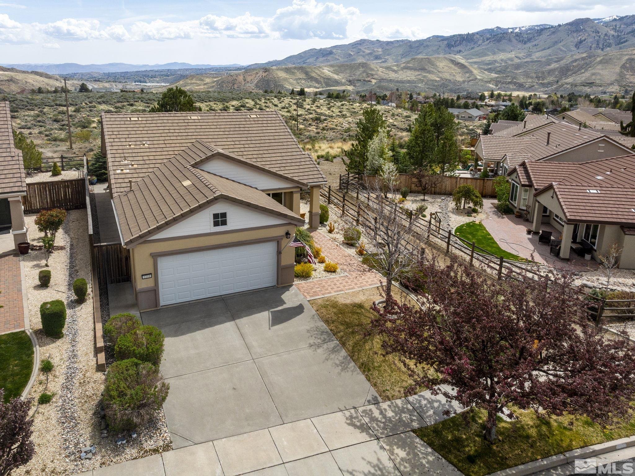 1210 Firefly Court Reno, NV 89523 - Photo 5 of 40 a view of a terrace with a lake and mountain view