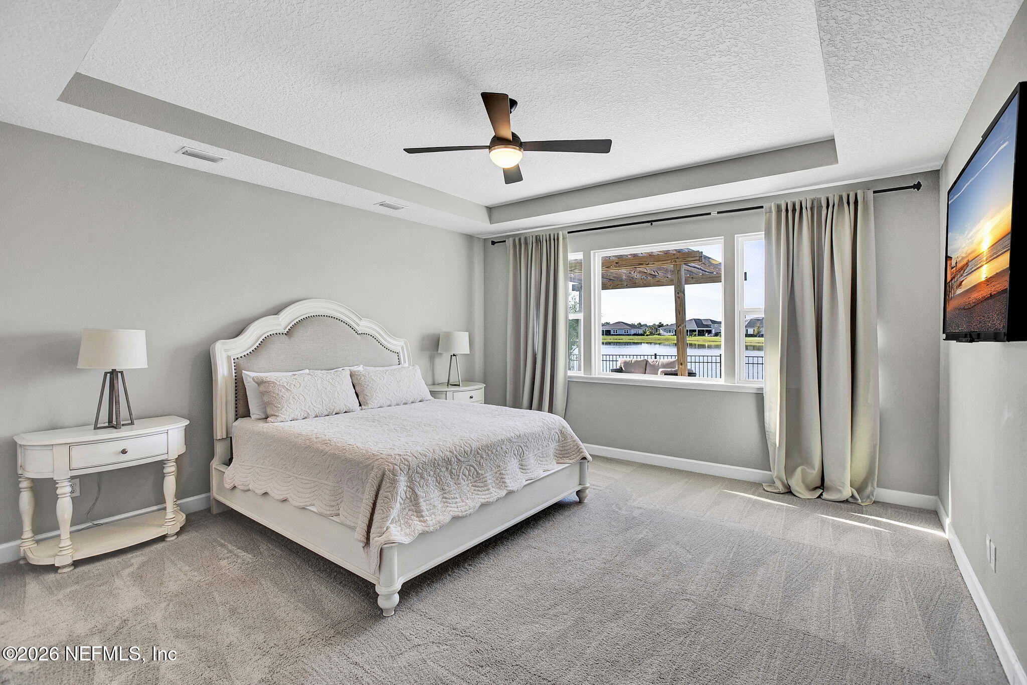 85401 Fall River Parkway Fernandina Beach, FL 32034 - Photo 13 of 38 a bedroom with a bed and a large window