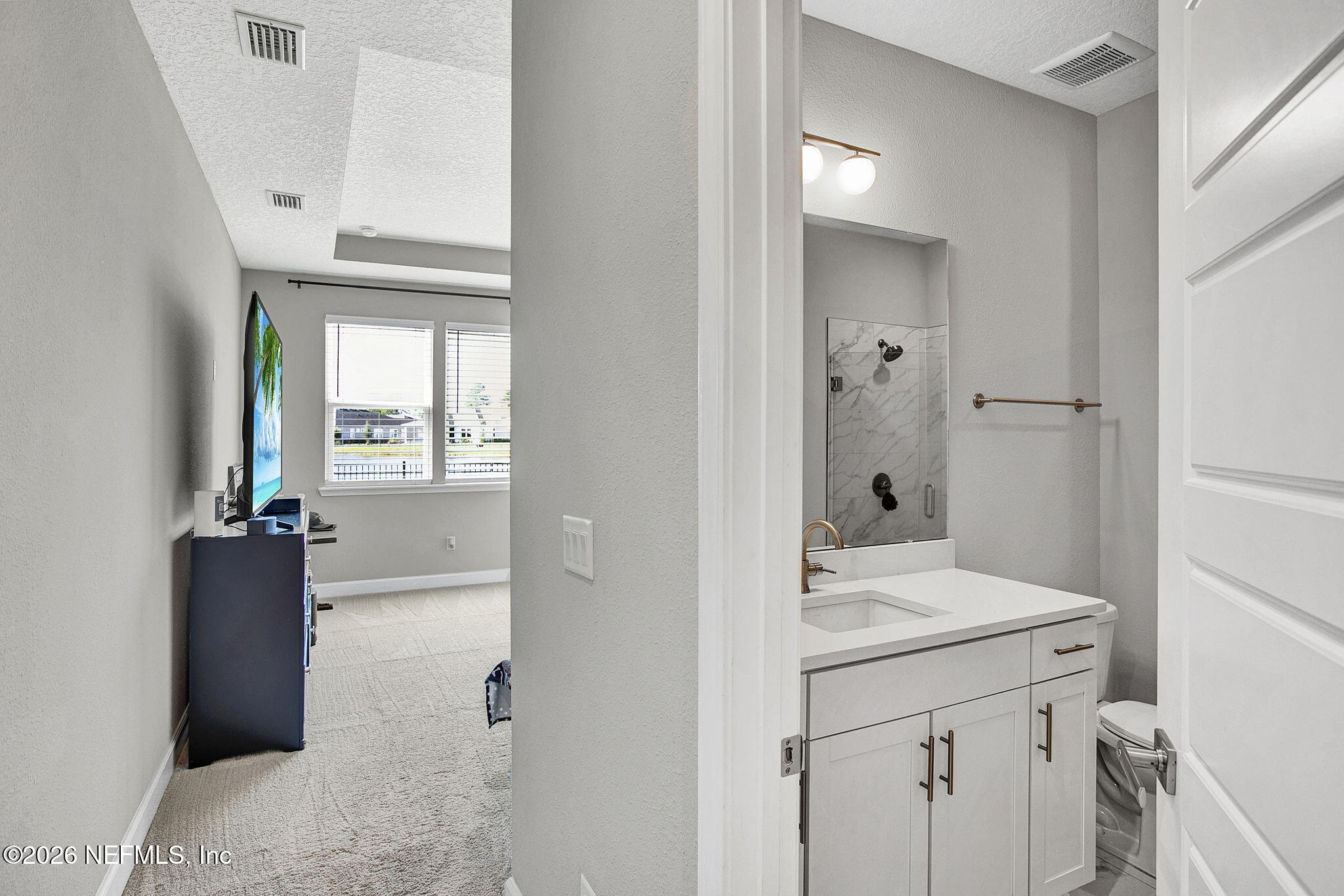 85401 Fall River Parkway Fernandina Beach, FL 32034 - Photo 19 of 38 a bathroom with a sink and a mirror