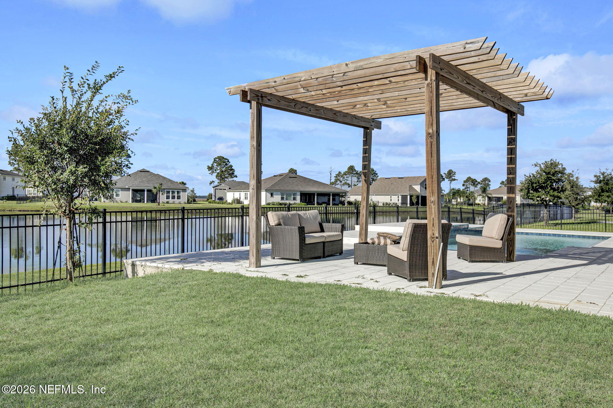 85401 Fall River Parkway Fernandina Beach, FL 32034 - Photo 29 of 38 a house view with a sitting space and garden view