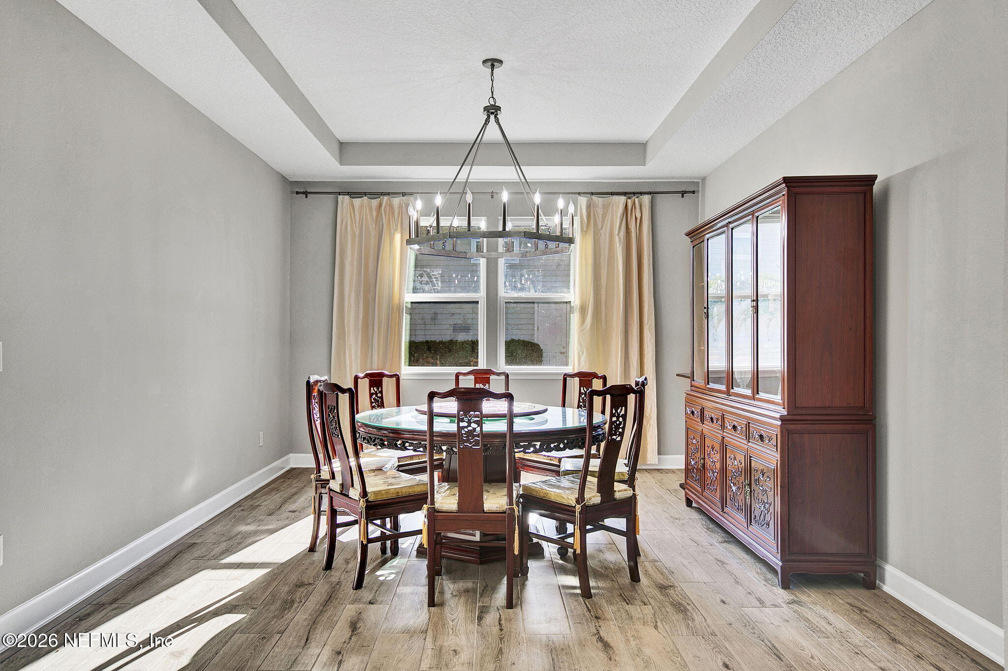 85401 Fall River Parkway Fernandina Beach, FL 32034 - Photo 32 of 38 a view of a dining room with furniture window and wooden floor