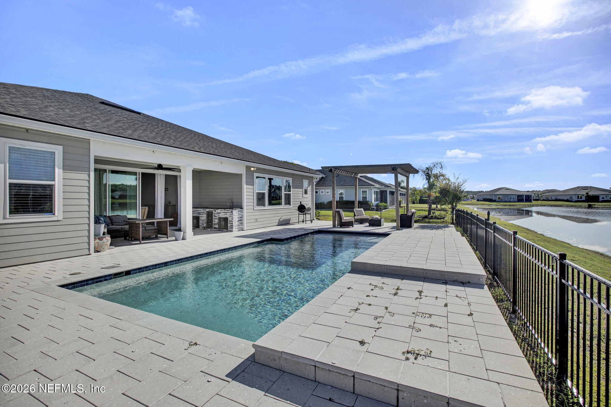 85401 Fall River Parkway Fernandina Beach, FL 32034 - Photo 33 of 38 a front view of a house with swimming pool