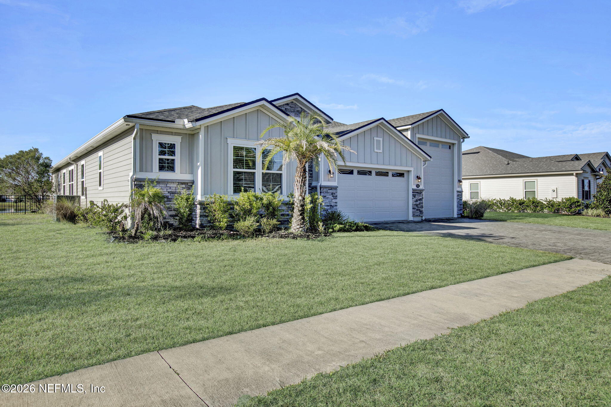 85401 Fall River Parkway Fernandina Beach, FL 32034 - Photo 38 of 38 a front view of a house with a garden