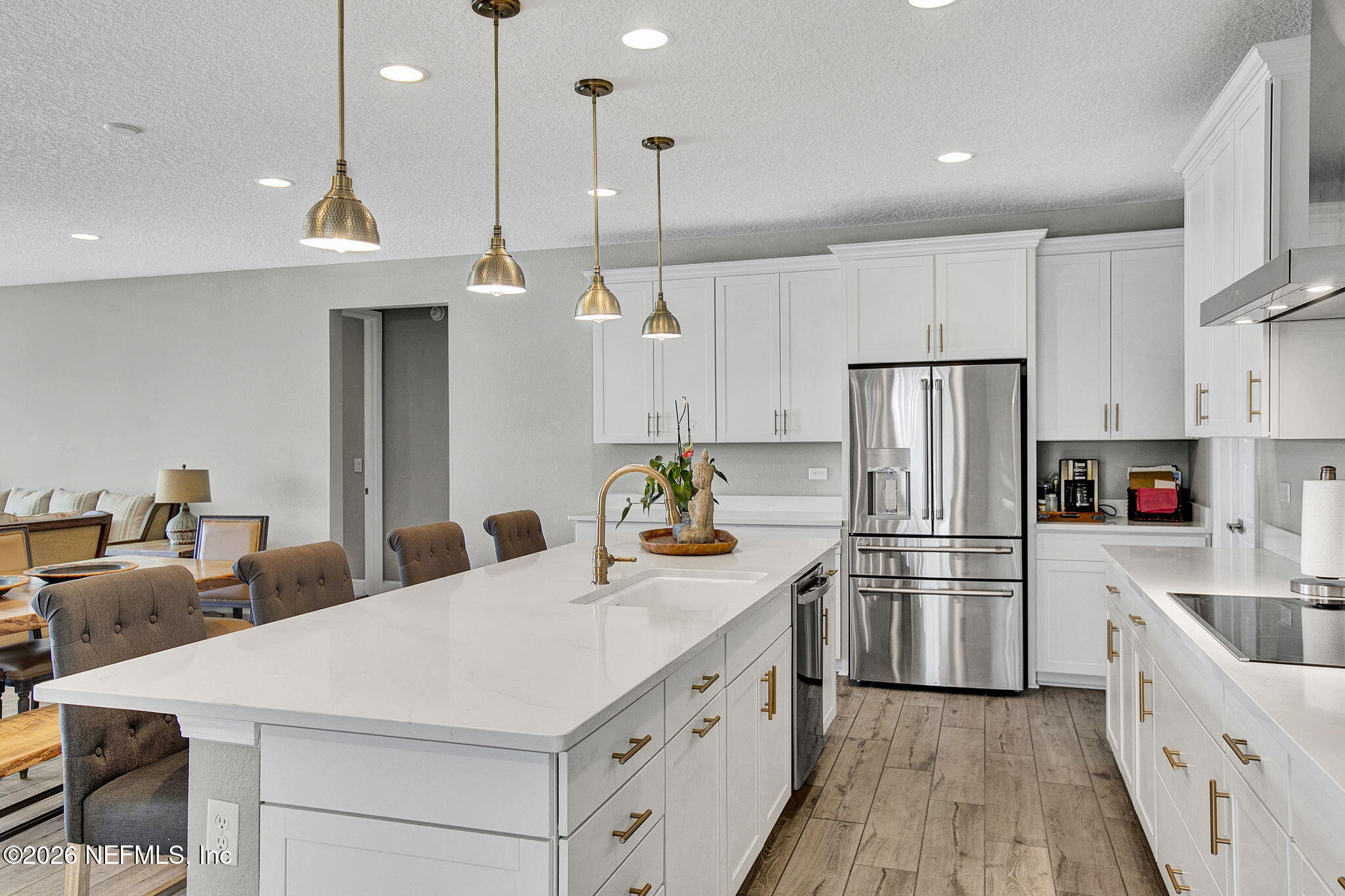 85401 Fall River Parkway Fernandina Beach, FL 32034 - Photo 6 of 38 a kitchen with stainless steel appliances a refrigerator sink and cabinets