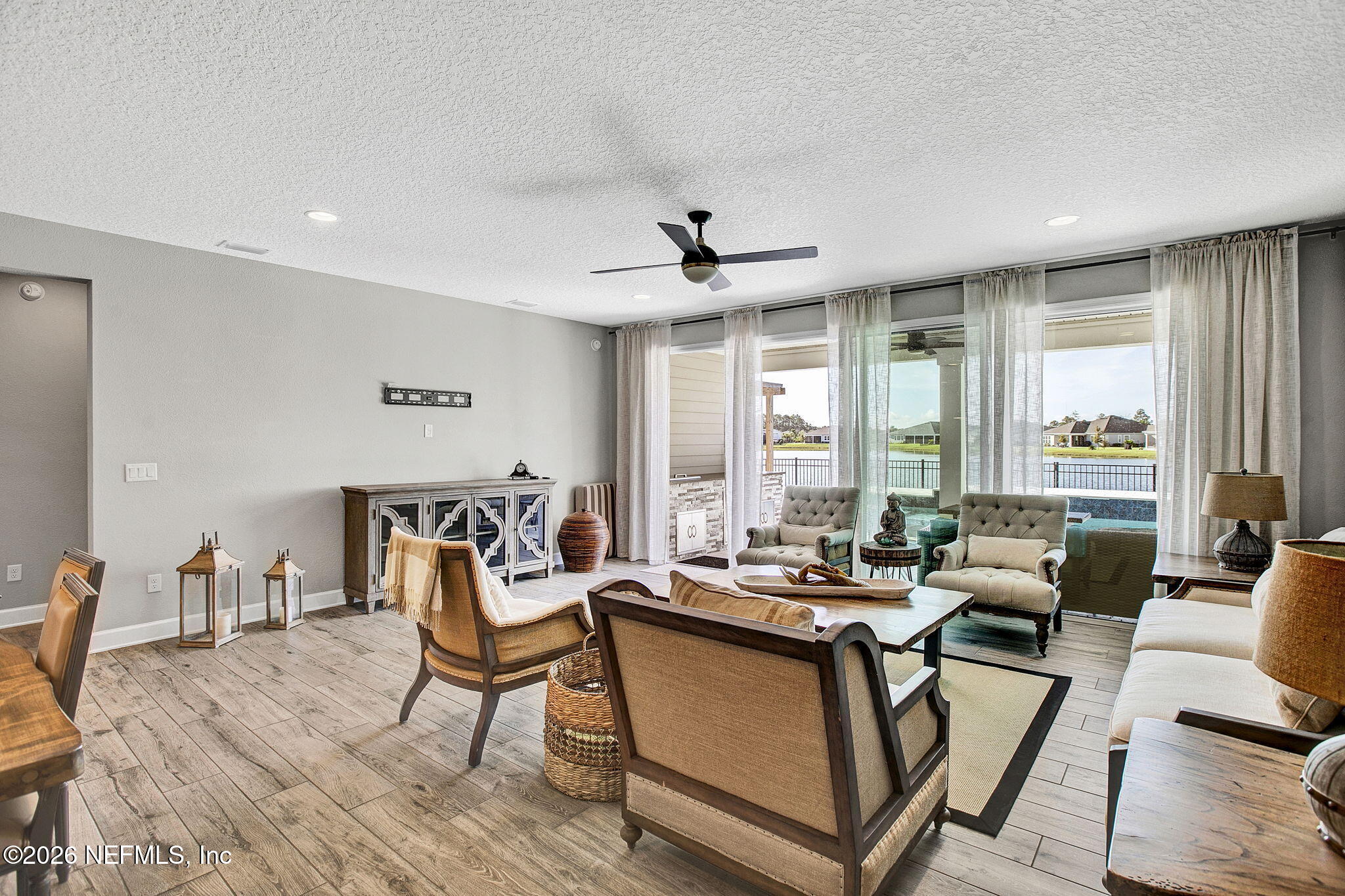 85401 Fall River Parkway Fernandina Beach, FL 32034 - Photo 10 of 38 a living room with furniture and large windows