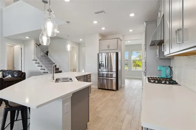a view of a dining room with a table and chairs