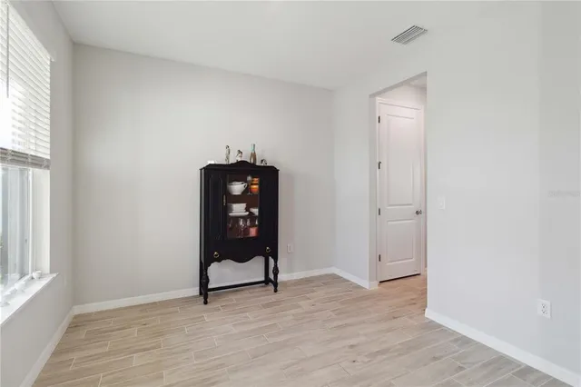 a view of an empty room with a window