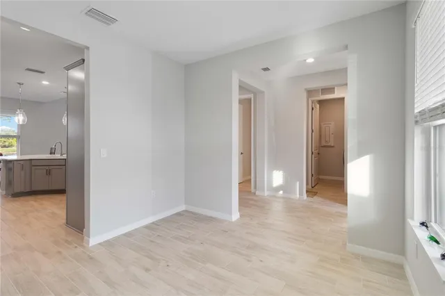 a bedroom with a bed and a television