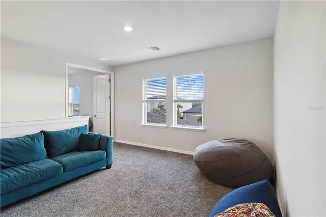 a bedroom with a bed and a couch