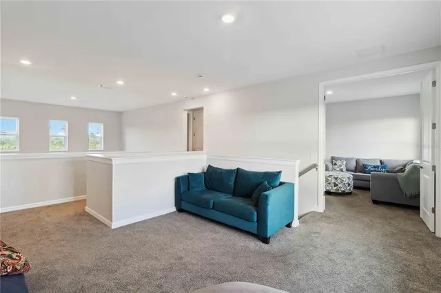 a bathroom with a sink vanity mirror and toilet
