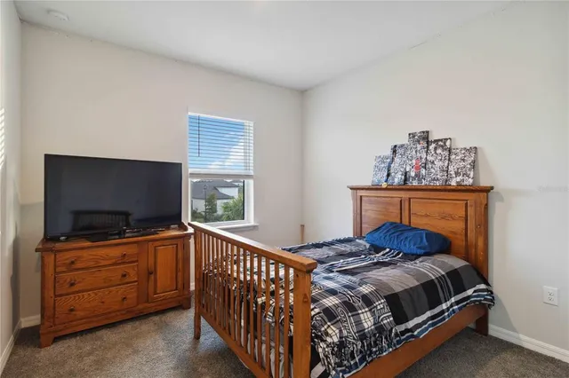 front view of a brick house with a yard