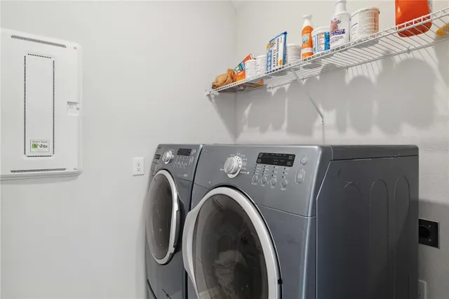 an aerial view of multiple houses with yard