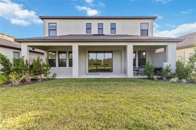 front view of a house with a fountain