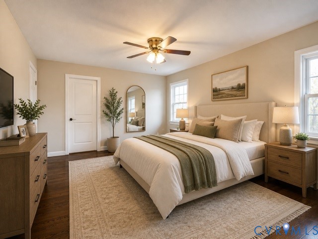 16487 Mountain Road Montpelier, VA 23192 - Photo 11 of 16 a spacious bedroom with a large bed and a chandelier