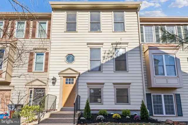 a view of a brick building with large windows