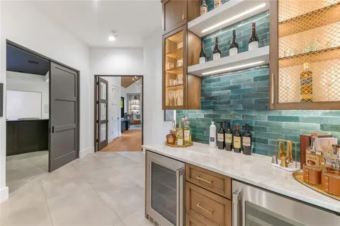 a kitchen with a sink stove and refrigerator