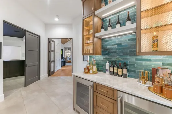a kitchen with a sink stove and refrigerator