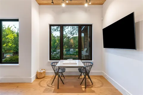 a view of a dining room with furniture window and outside view