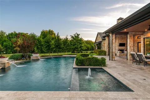 swimming pool view with a seating space