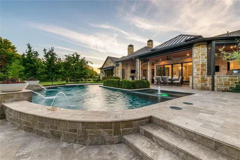 a view of swimming pool with a patio