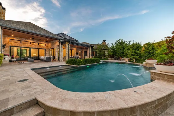 a view of swimming pool with outdoor seating