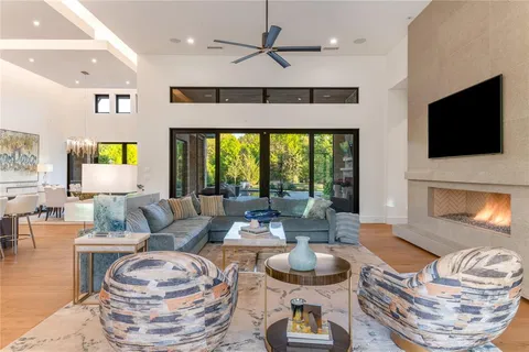 a living room with fireplace furniture and a flat screen tv