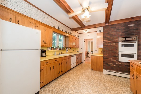 39 Farmcrest Avenue Lexington, MA 02421 - Photo 11 of 26 a large kitchen with stainless steel appliances granite countertop a refrigerator a oven a sink and dishwasher