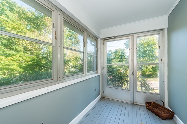39 Farmcrest Avenue Lexington, MA 02421 - Photo 12 of 26 a view of a room with wooden floor and windows